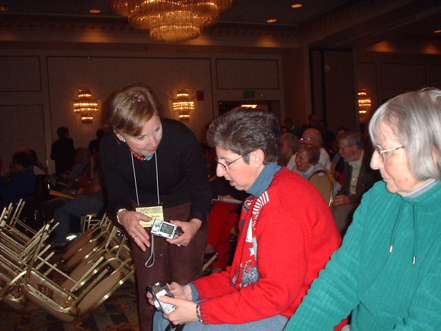 Ann Marie McNamara and Nancy Shack compare cameras